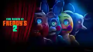 Arte promocional de la película Five Nights at Freddy’s 2 donde los animatrónicos Toy Freddy, Toy Bonnie y Toy Chica se asoman tras una cortina roja junto al título del filme. Arte promocional de la película Five Nights at Freddy’s 2 donde los animatrónicos Toy Freddy, Toy Bonnie y Toy Chica se asoman tras una cortina roja junto al título del filme.