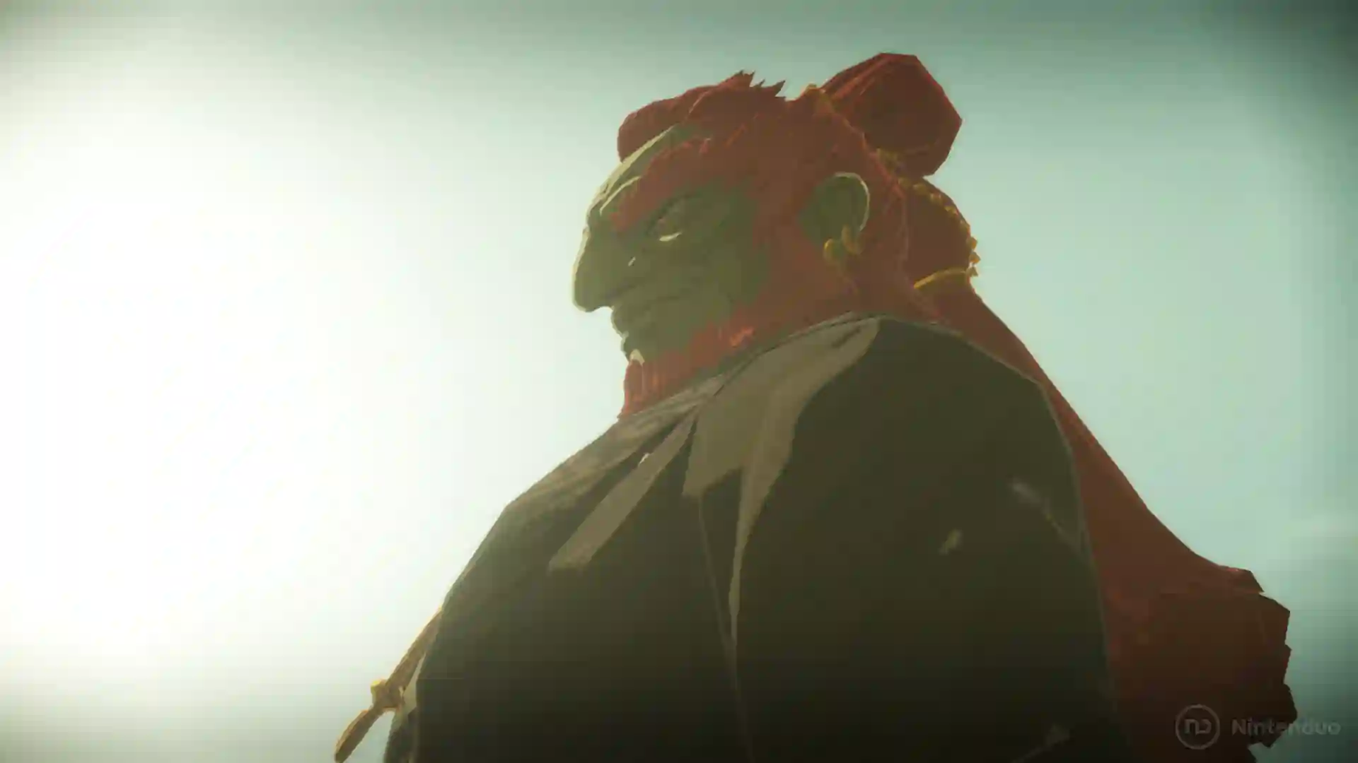 Hyrule Warriors: La Era del Destierro – primer plano de Ganondorf de perfil, con piel verde y cabello rojo, mirando con expresión seria bajo la luz del sol.