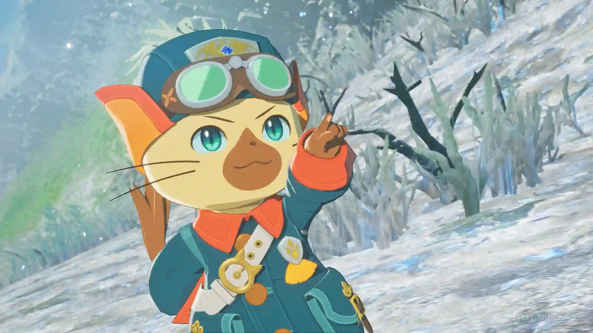 Monster Hunter Stories 3: el personaje felyne con grandes gafas verdes en la cabeza y una chaqueta azul mira y señala con el dedo en un paisaje nevado.