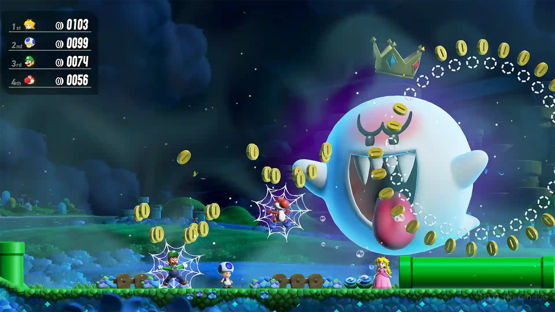 Super Mario Bros. Wonder – Nintendo Switch 2 Edition: un Boo gigante con corona lanzando monedas doradas en un cielo oscuro con telarañas, acompañado de un marcador de puntuaciones en la izquierda.