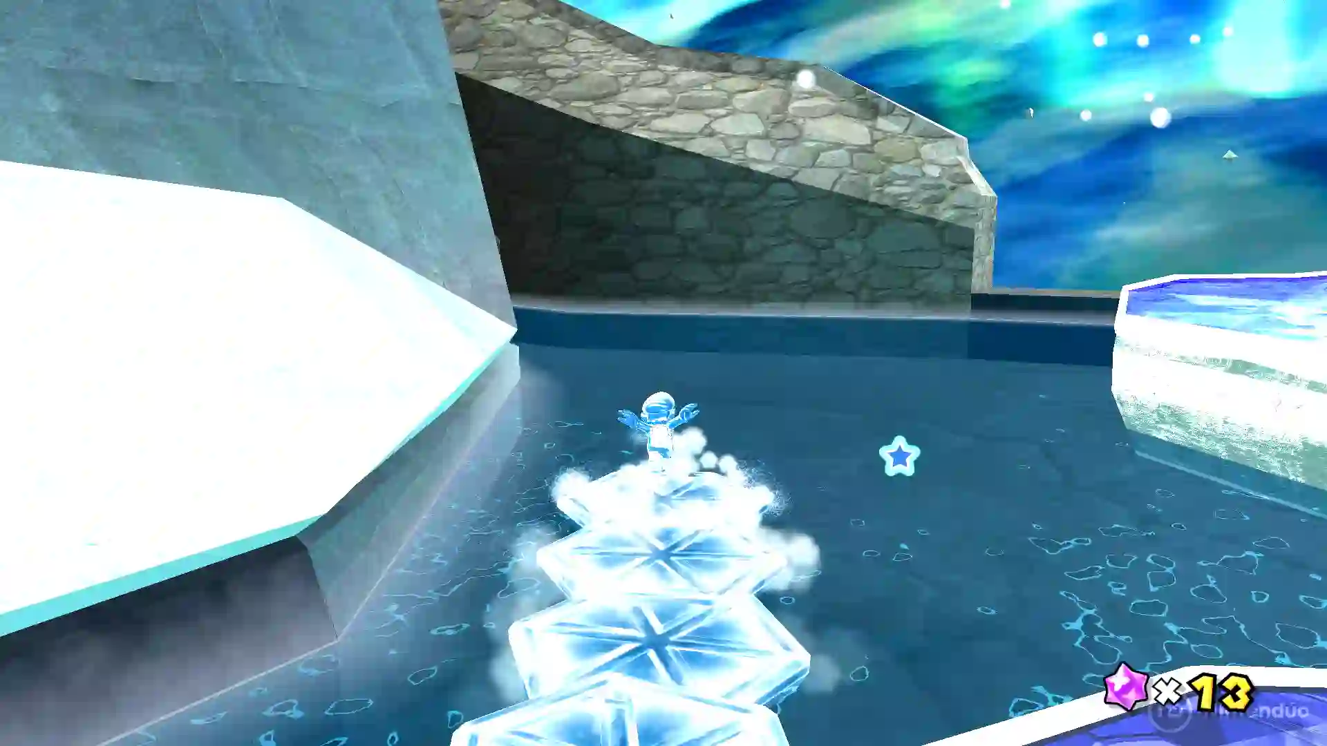 Mario de Super Mario Galaxy patinando sobre una pista de hielo en un lago gélido, dejando una estela de estrellas azules.