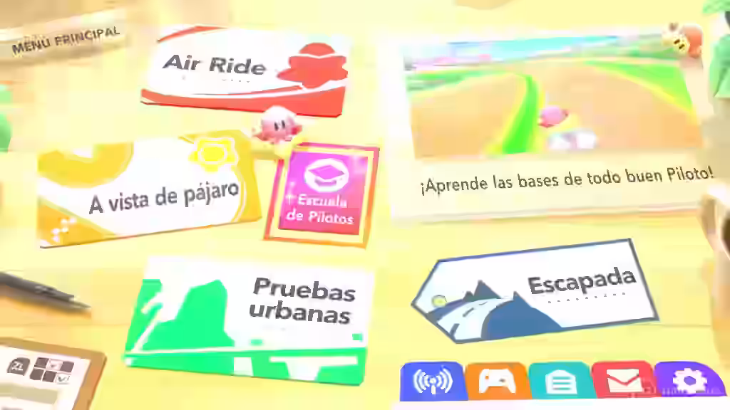 Pantalla del menú principal de Kirby Air Riders ND con varias tarjetas de modos como Air Ride, A vista de pájaro, Escuela de Pilotos, Pruebas urbanas y Escapada sobre una mesa
