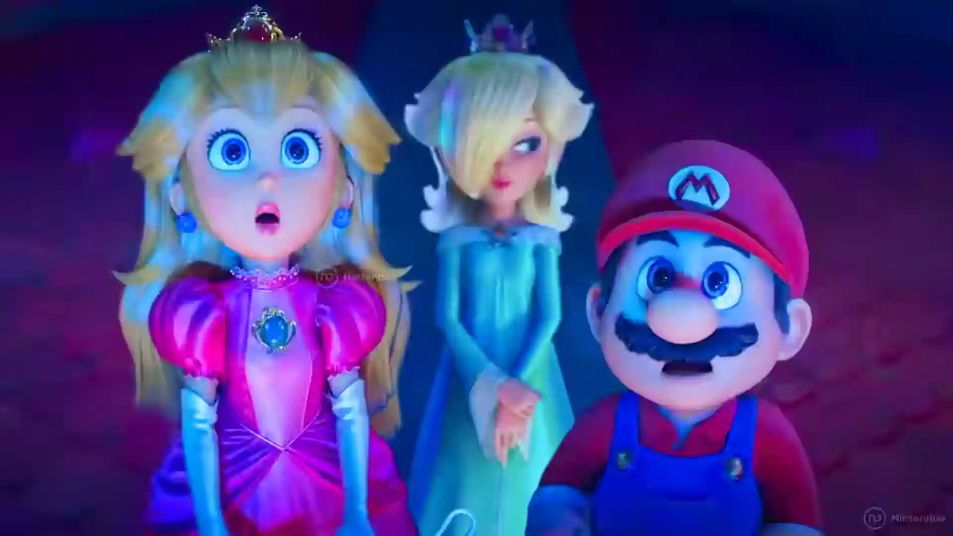 La Princesa Peach, Estela (Rosalina) y Mario contemplan con asombro en una escena de la película Super Mario Galaxy, presentando a parte del reparto principal.