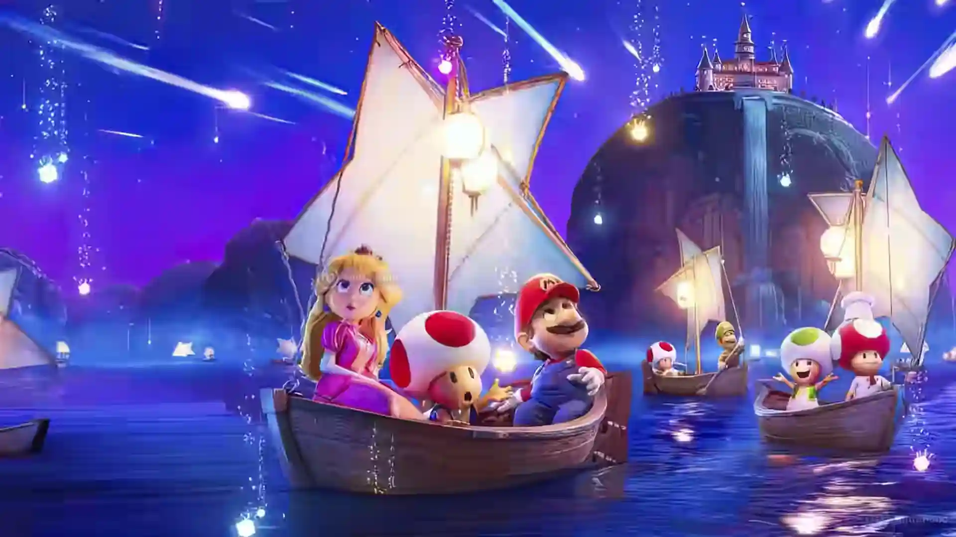 Póster de Super Mario Galaxy La Película con Mario, Peach y varios Toad navegando en barcas con velas en forma de estrella sobre el mar nocturno, con un castillo iluminado al fondo.