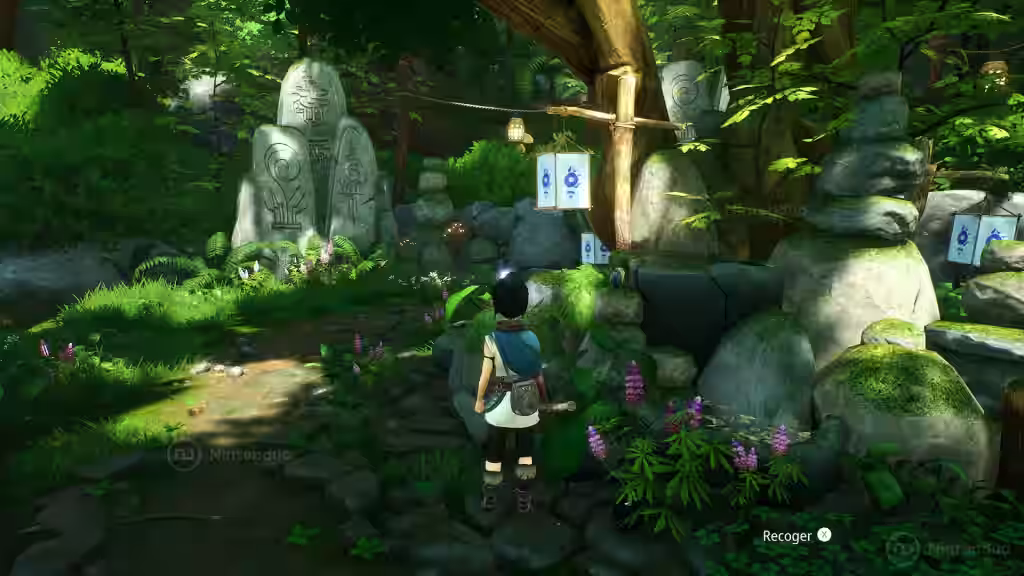 Kena explora un santuario entre estatuas de piedra y flores en Kena: Bridge of Spirits para Nintendo Switch 2.