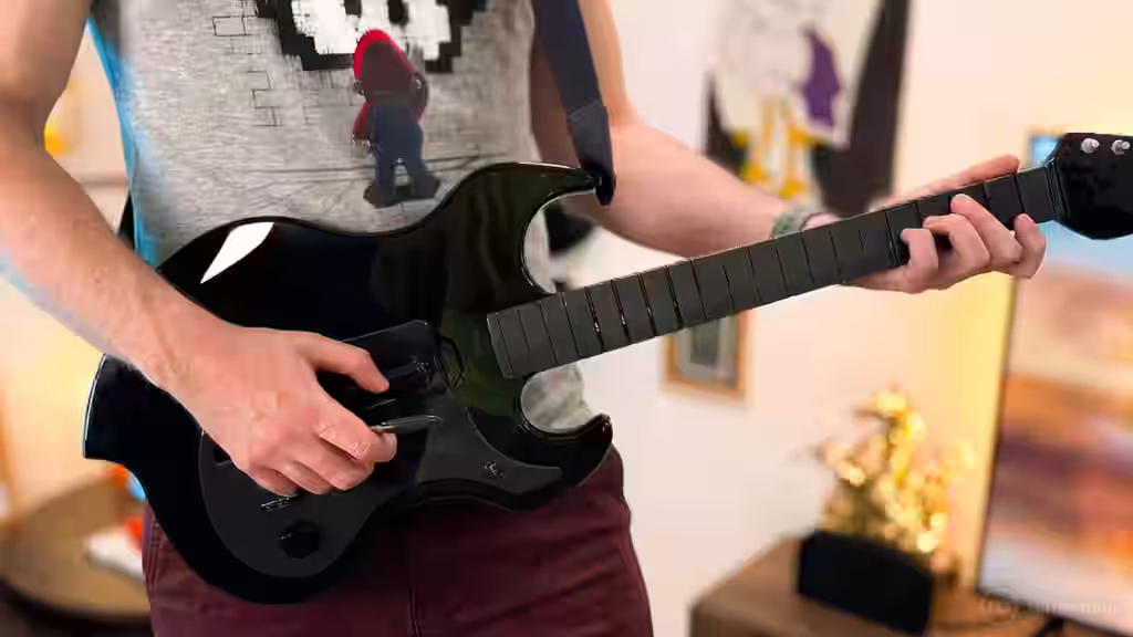 Guitarra para videojuegos Turtle Beach para Nintendo Switch 2 en manos de un jugador